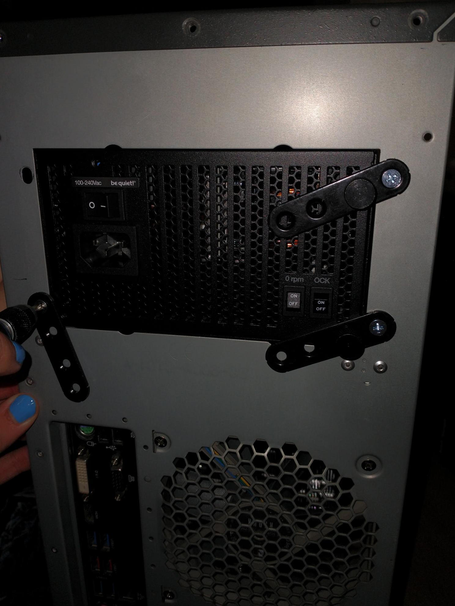 Mounting a power supply in our case using three screw plates.